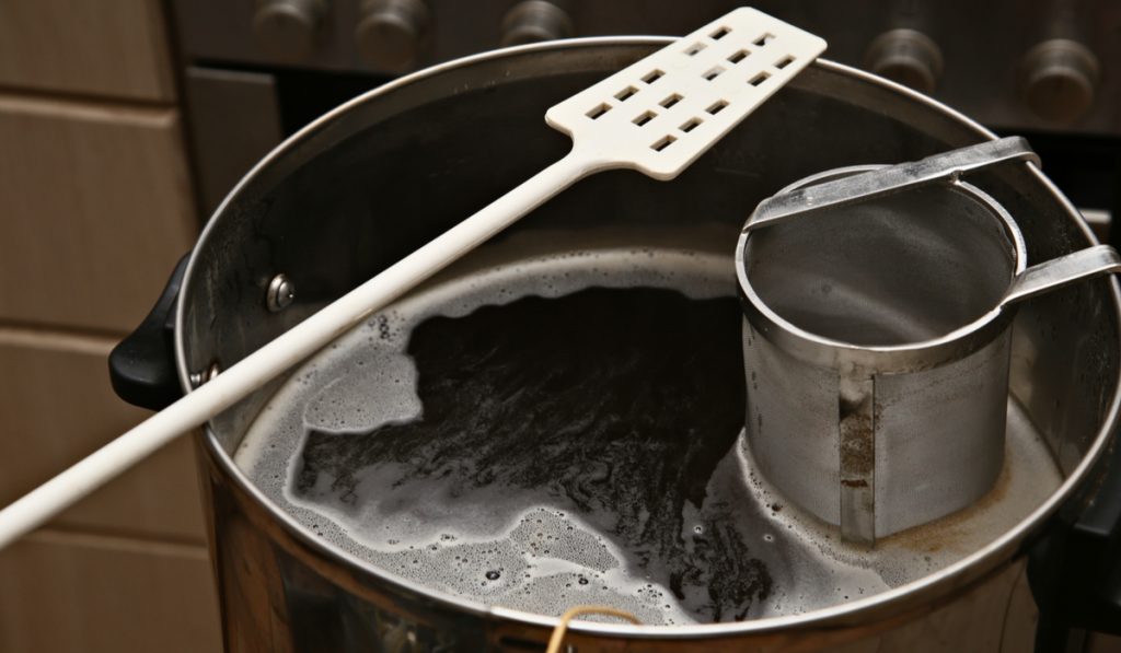 Brewing craft beer in a kitchen.