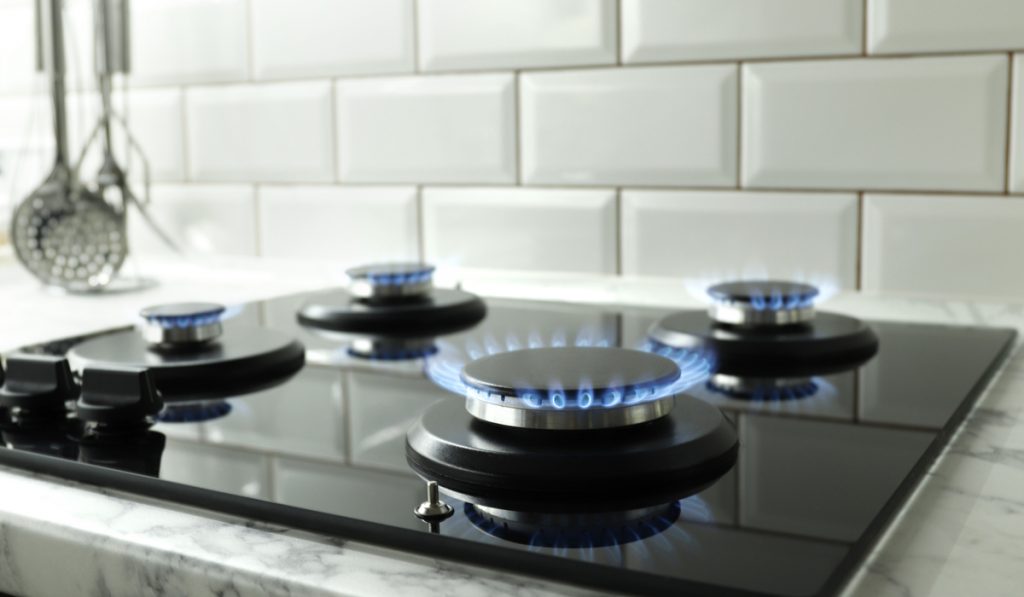 closeup shot blue fire domestic kitchen gas stove