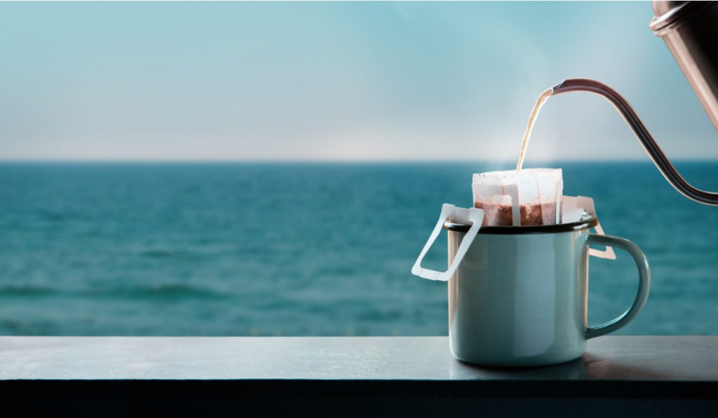 dripping coffee by sea side morning