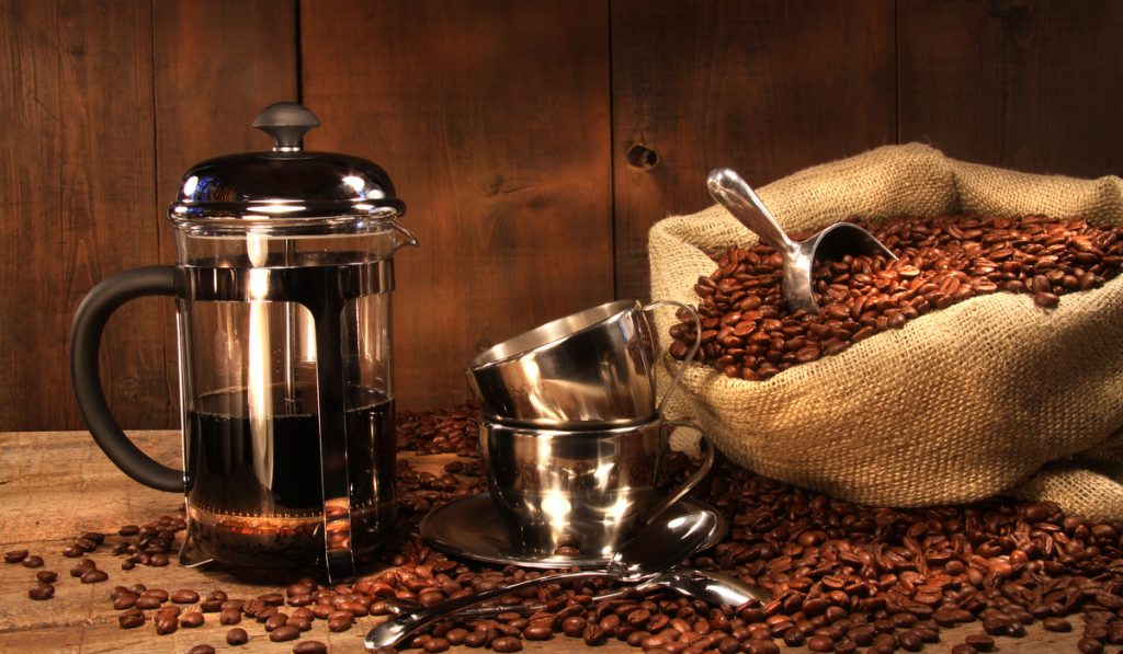sack coffee beans two cups French press cups