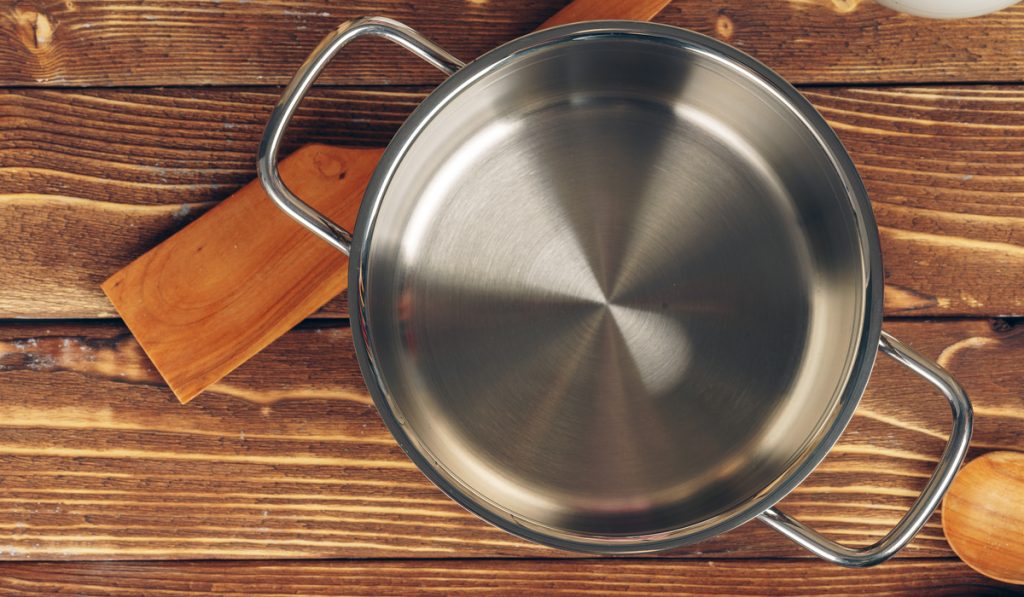 stainless cookware pot wooden spatula 