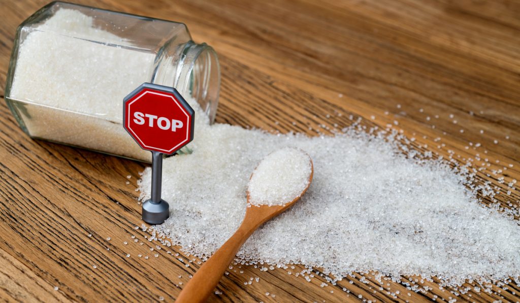 stop sign granulated sugar wooden spoon