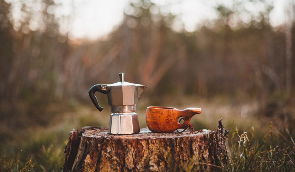 stovetop moka pot coffe maker wooden cup forest