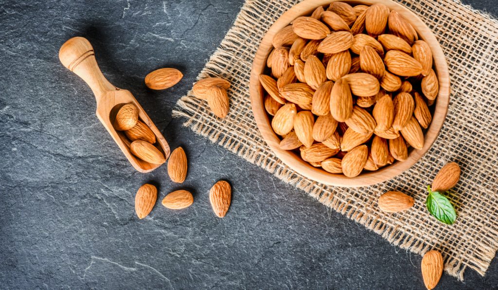 top view almonds on dark stone 